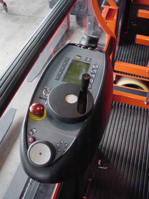 Ergonomic operator console with rotational operator controls